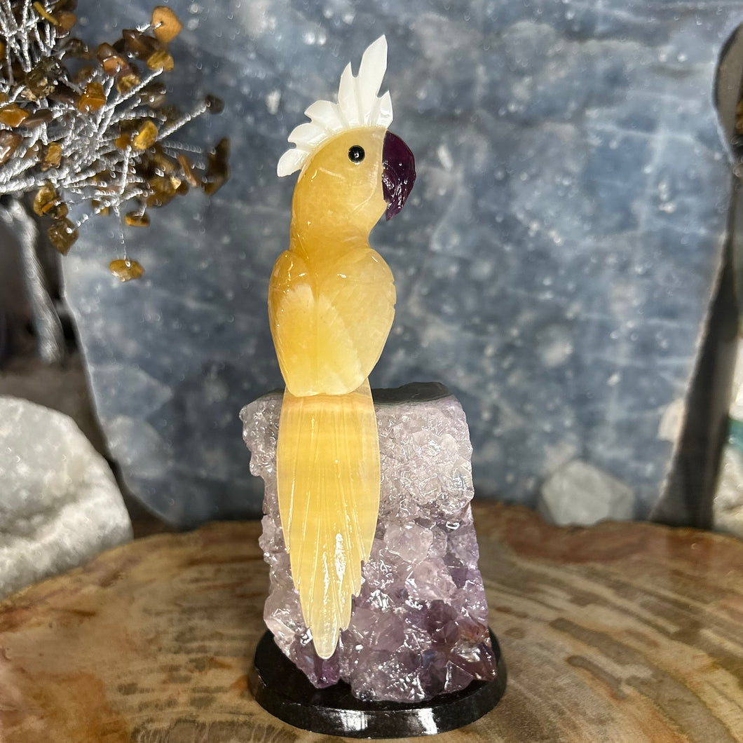 Orange Calcite Hand Carved Cockatoo Perched on Amethyst